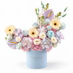 Azure Drift main view, blue and blush hydrangea, white roses, cream gerberas, white lisianthus and lilac anthuriums in a powder blue Rosarium box