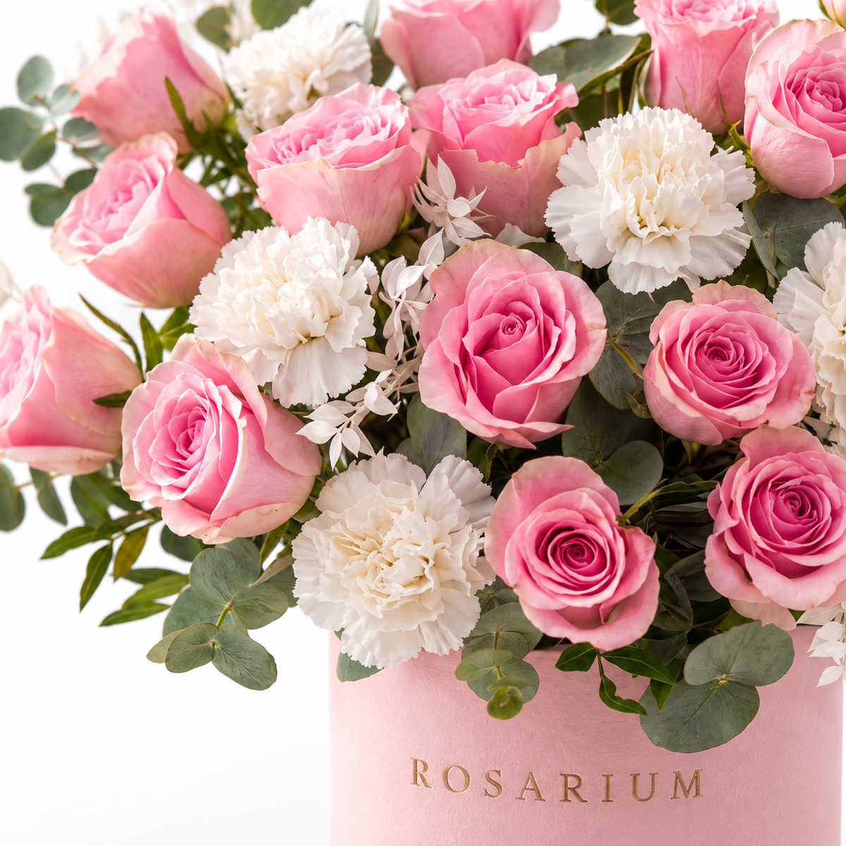 Rosita Ruffle floral detail, pink roses and white carnations in a light pink Rosarium box