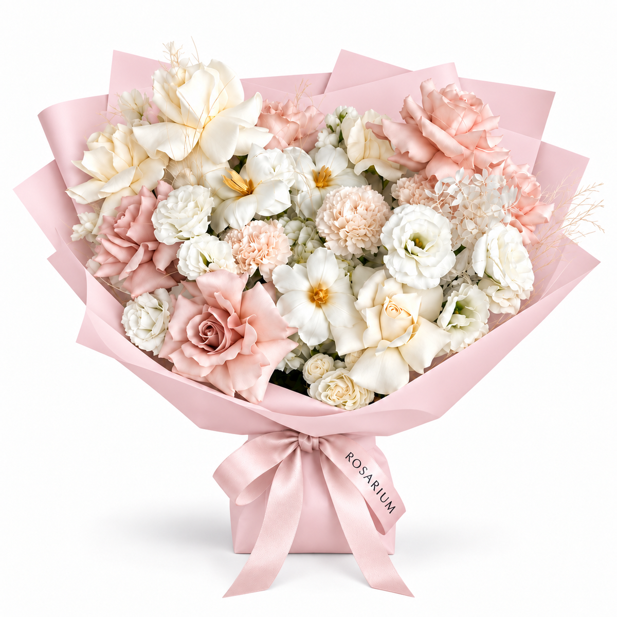 Soft-Spoken Romance, white and blush roses, tulips, lisianthus and carnations in light pink wrapping