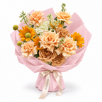 Apricot Sunshine, apricot roses, sunflowers, cream stock and hydrangea in light pink wrapping
