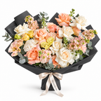 Garden in Blush, white and peach roses, peach lisianthus and white stock in black wrapping