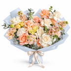 Garden in Blush, white and peach roses, peach lisianthus and white stock in blue wrapping