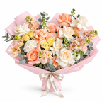 Garden in Blush, white and peach roses, peach lisianthus and white stock in light pink wrapping