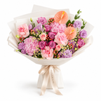 Blush After Dark, deep-purple and pink roses, pink hydrangea, anthuriums and purple lisianthus in off-white wrapping
