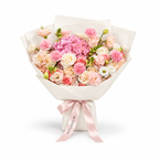 Coral Spark, cream and coral roses, pink hydrangea, carnations and cream lisianthus in off-white wrapping