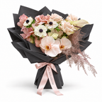 Cream with an Edge, cream and blush roses, white anemones and cream orchids in black wrapping