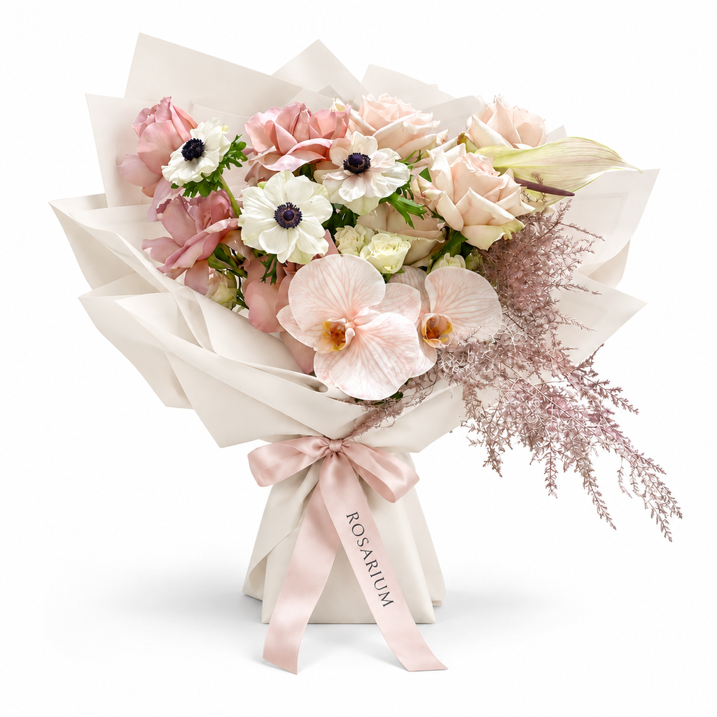 Cream with an Edge, cream and blush roses, white anemones and cream orchids in off-white wrapping