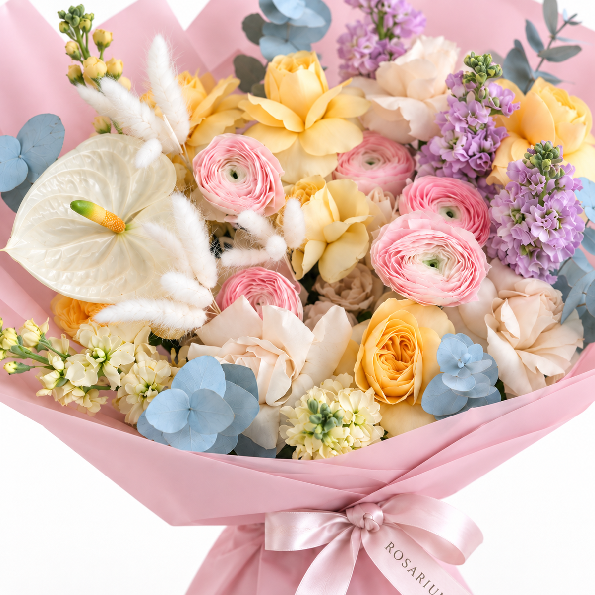 Colour Daydream, yellow roses, pink ranunculus, white anthuriums and lavender stock, floral detail
