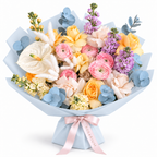 Colour Daydream, yellow roses, pink ranunculus, white anthuriums and lavender stock in blue wrapping