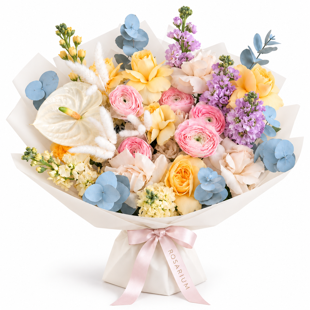 Colour Daydream, yellow roses, pink ranunculus, white anthuriums and lavender stock in off-white wrapping