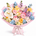 Colour Daydream, yellow roses, pink ranunculus, white anthuriums and lavender stock in light pink wrapping