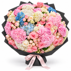 Hydrangea Drama, pink, white and blue hydrangea with blush and cream roses in black wrapping