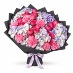 Lavender Hush, lavender hydrangea, blush roses and pink carnations in black wrapping