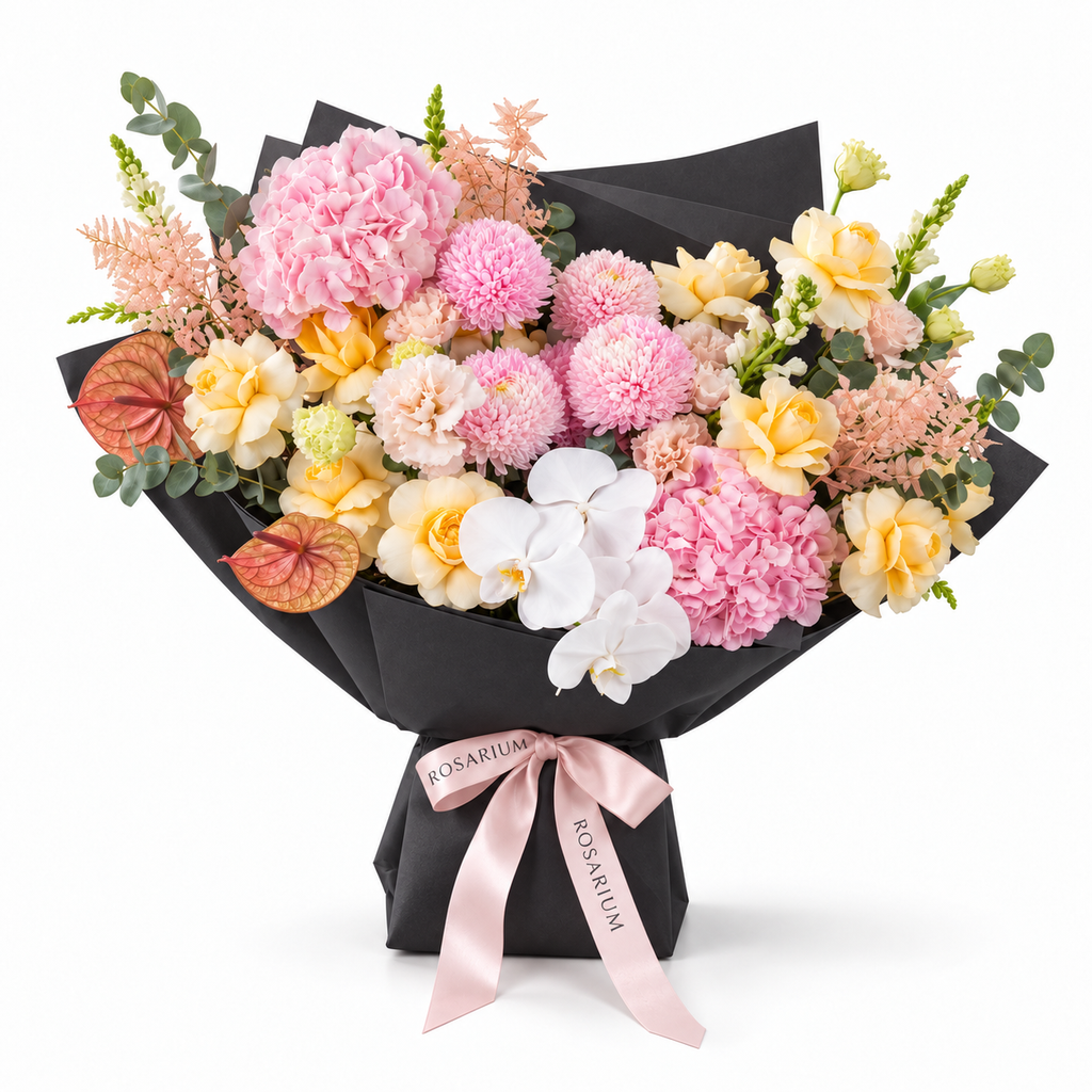 Marina in Colour, yellow roses, pink chrysanthemums, white orchids, hydrangea and lisianthus in black wrapping