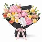 Marina in Colour, yellow roses, pink chrysanthemums, white orchids, hydrangea and lisianthus in black wrapping