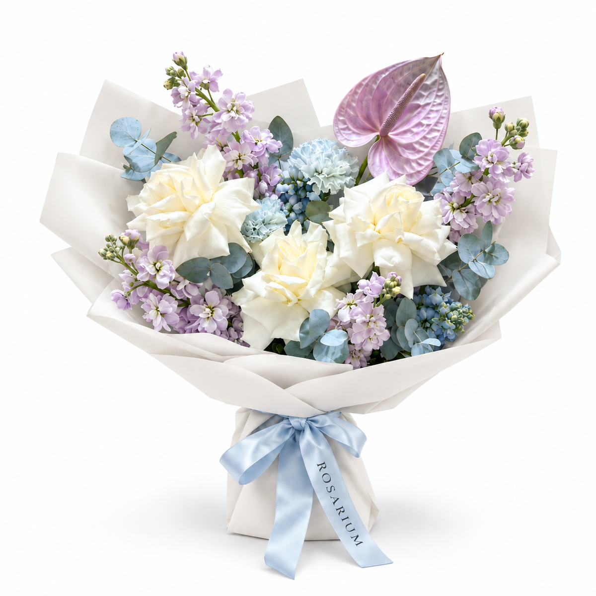Lilac Orbit, white roses, lilac stock, blue carnations and lilac anthurium in off-white wrapping