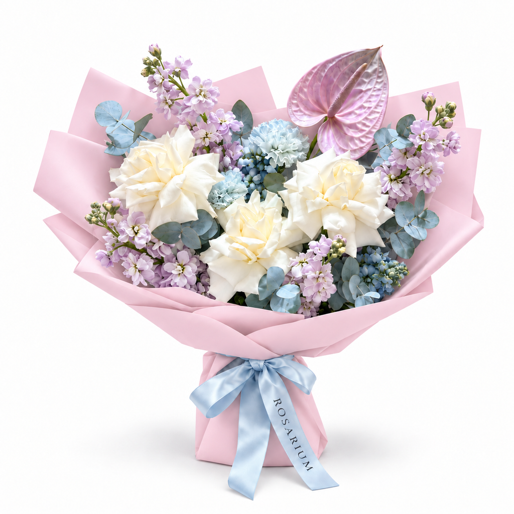 Lilac Orbit, white roses, lilac stock, blue carnations and lilac anthurium in light pink wrapping