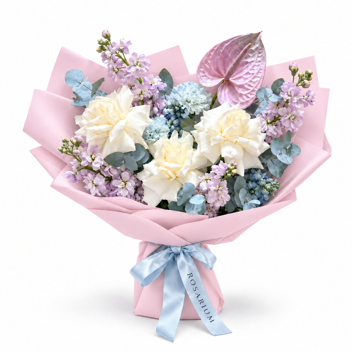 Lilac Orbit, white roses, lilac stock, blue carnations and lilac anthurium in light pink wrapping