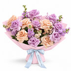 Ocean Hush, soft-purple and taupe roses with seasonal pastel blooms in light pink wrapping