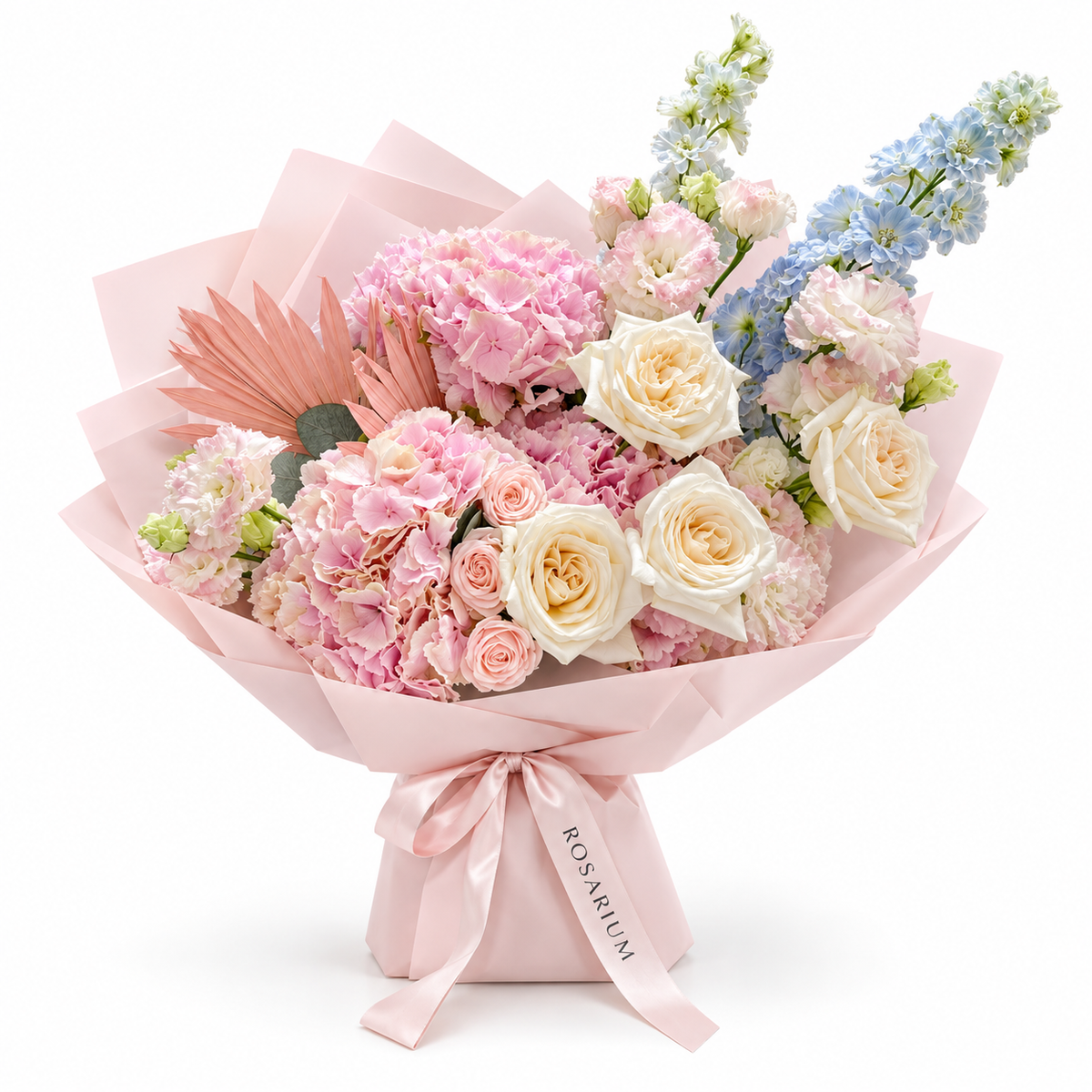 Blue in the Blush, pink hydrangea, blush roses and pale-blue delphinium in light pink wrapping