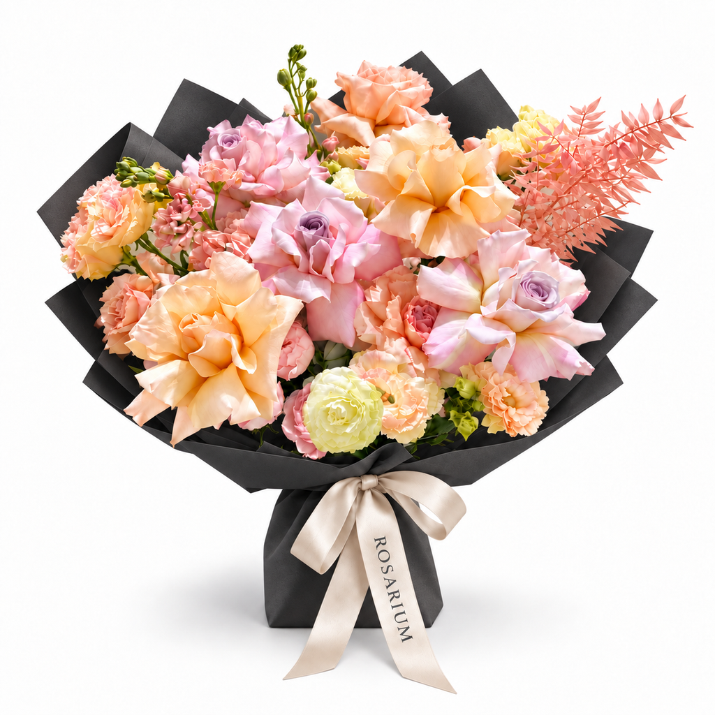 Peach Blush Club, pink and peach roses, spray roses, white stock and lisianthus in black wrapping