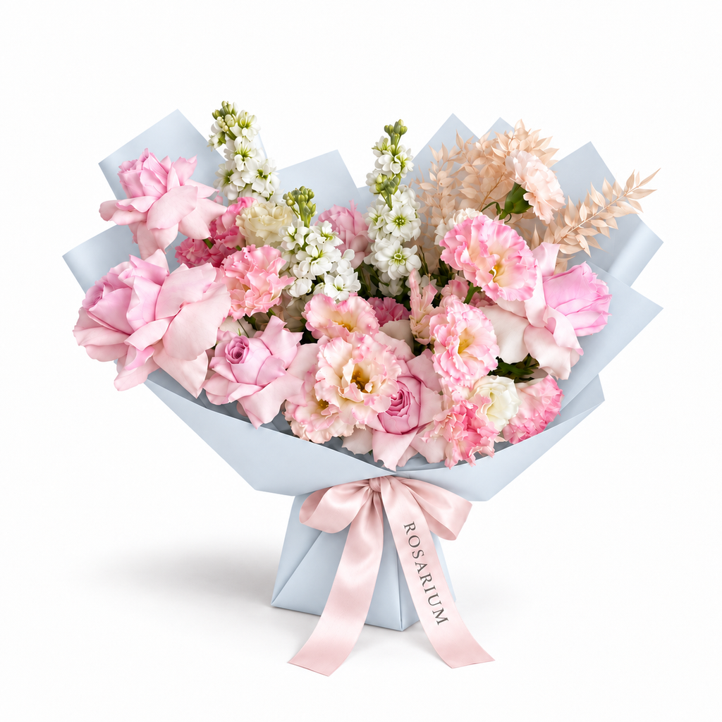 Pretty, Unfussy, pink roses, white lisianthus and white stock in blue wrapping