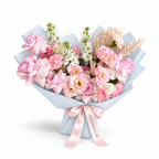 Pretty, Unfussy, pink roses, white lisianthus and white stock in blue wrapping