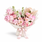 Pretty, Unfussy, pink roses, white lisianthus and white stock in off-white wrapping
