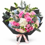 Rosé for No Reason, soft-pink roses and white and pale-blue hydrangea in black wrapping