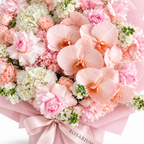 Pink Lemonade Deluxe, light-pink roses, white orchids and white and blush hydrangea, floral detail