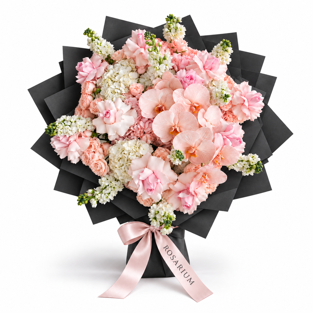 Pink Lemonade Deluxe, light-pink roses, white orchids and white and blush hydrangea in black wrapping