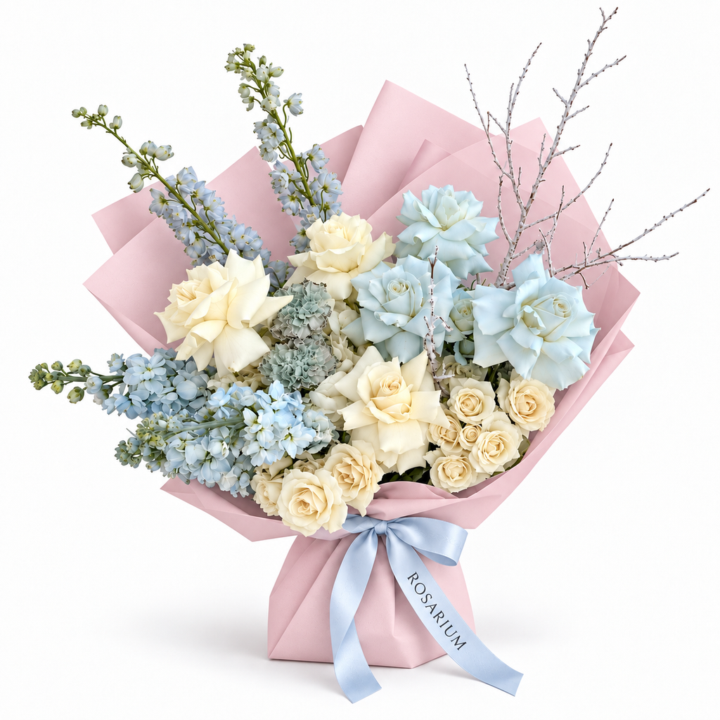 White on Ice, white and pale-blue roses, blue stock and delphinium in light pink wrapping