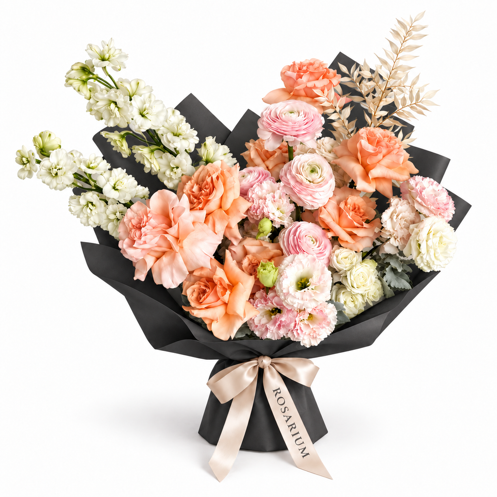 Peach in Bloom, peach roses, blush ranunculus, white stock and cream blooms in black wrapping