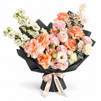 Peach in Bloom, peach roses, blush ranunculus, white stock and cream blooms in black wrapping