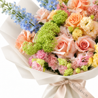 Spring with a Twist, blue delphinium, peach roses, yellow spray roses and blush carnations, floral detail