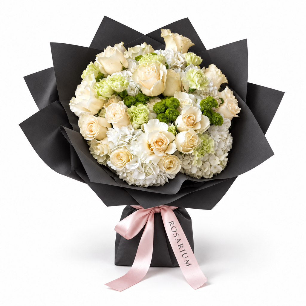 Buttercream Spring, cream and pale-yellow roses with white hydrangea in black wrapping