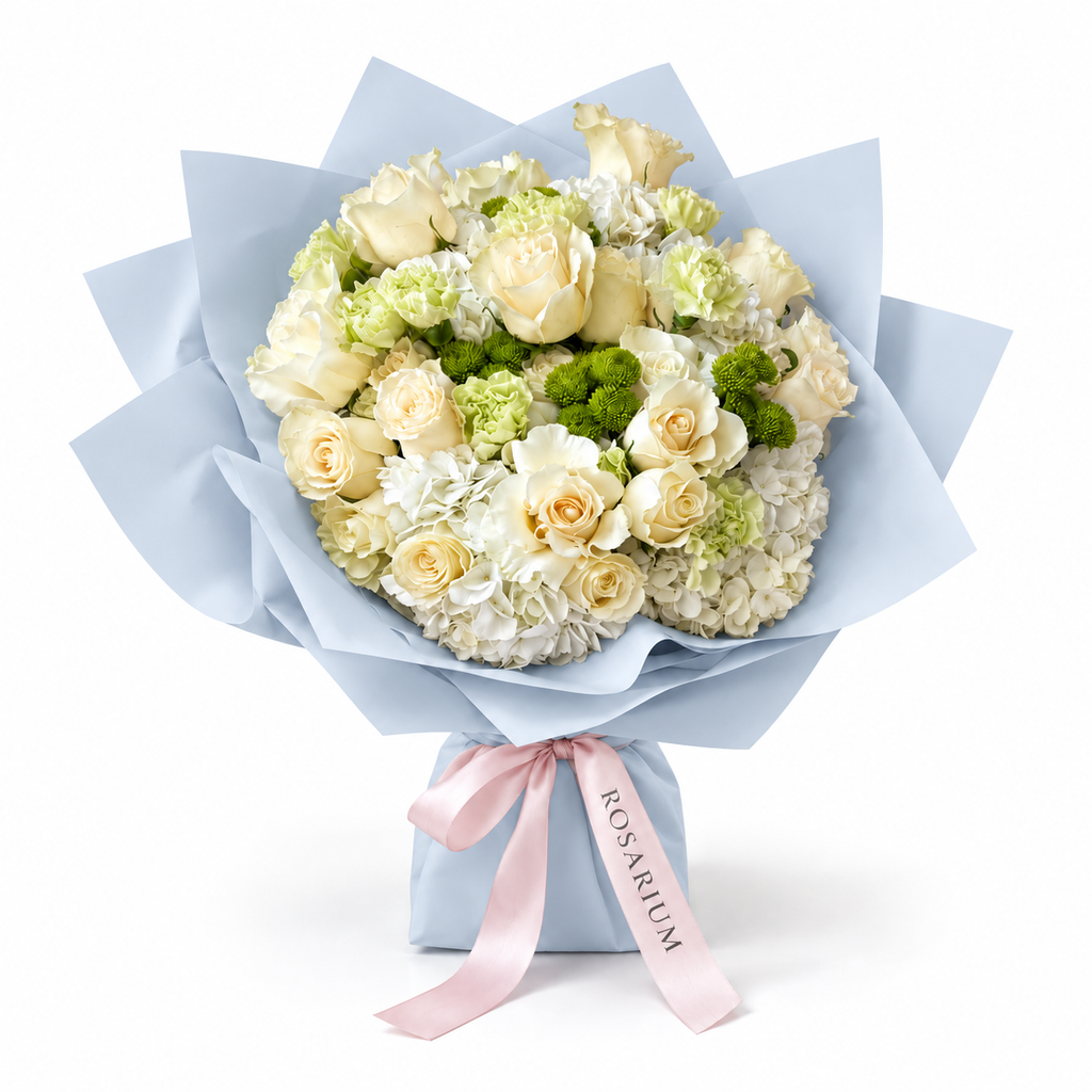 Buttercream Spring, cream and pale-yellow roses with white hydrangea in blue wrapping