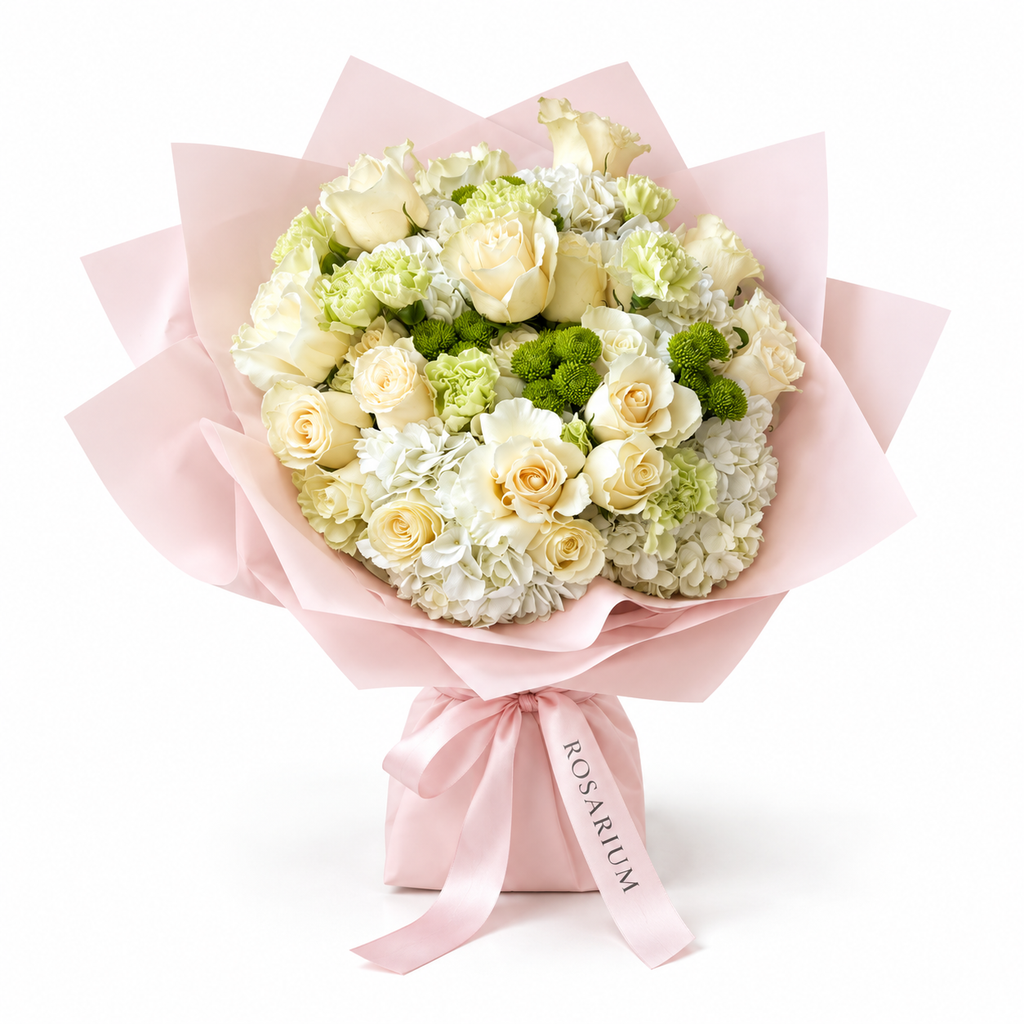 Buttercream Spring, cream and pale-yellow roses with white hydrangea in light pink wrapping