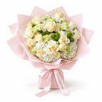 Buttercream Spring, cream and pale-yellow roses with white hydrangea in light pink wrapping