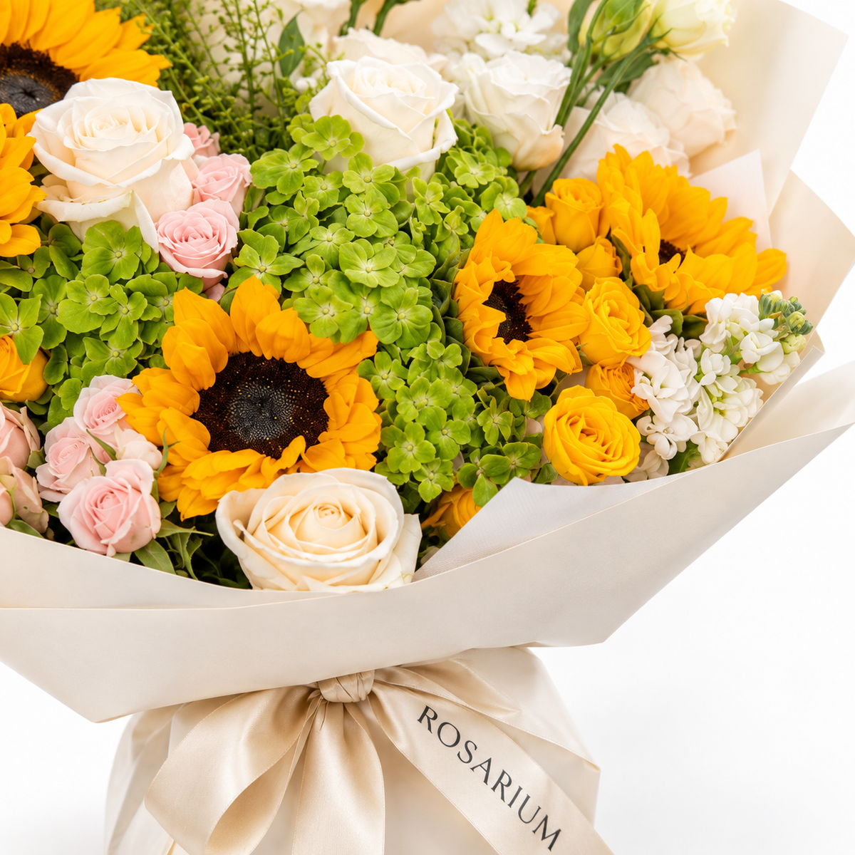 Sunshine Chorus, sunflowers, green hydrangea, pink and yellow spray roses and white stock, floral detail