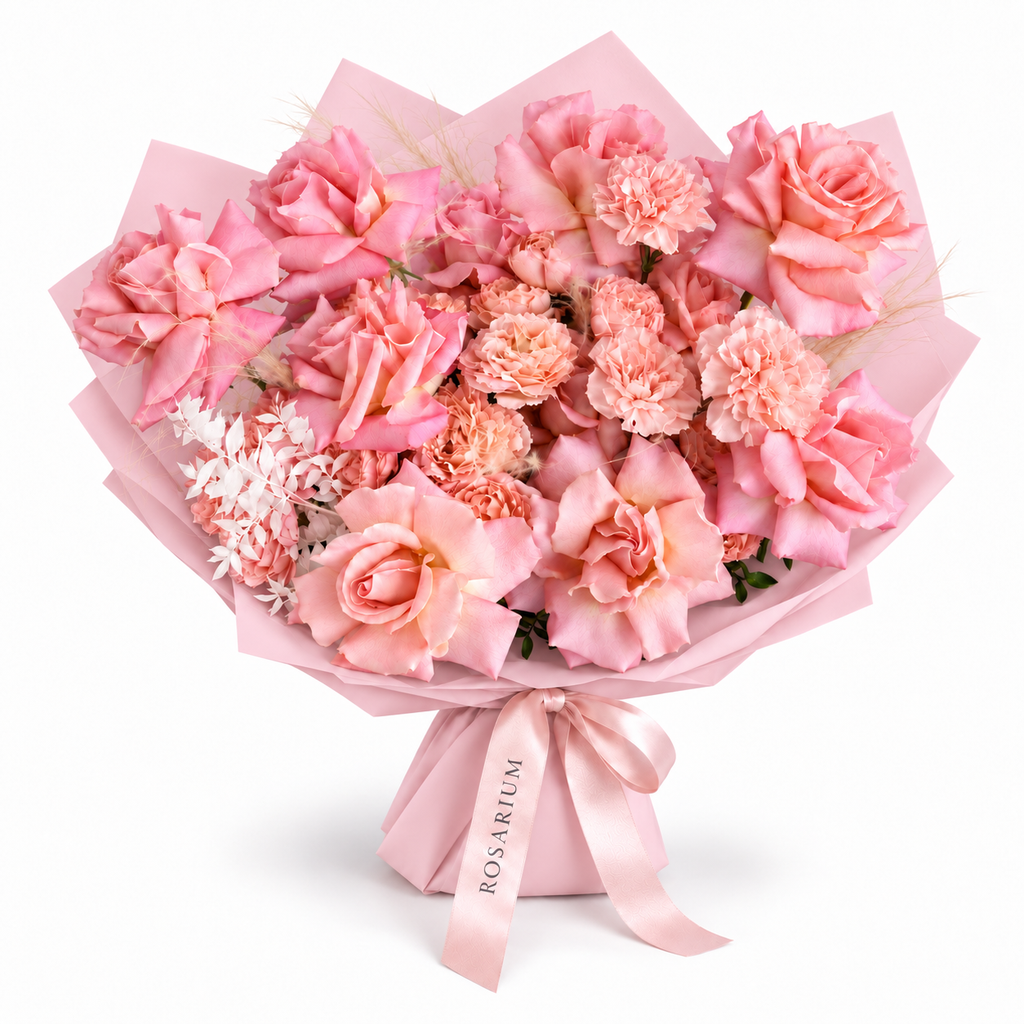 Tuscan Afterglow, peach and salmon roses and carnations in light pink wrapping
