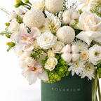 Ivory & Moss floral detail, ivory roses, white orchids, white chrysanthemums, cotton bolls and green hydrangea in a forest green Rosarium box
