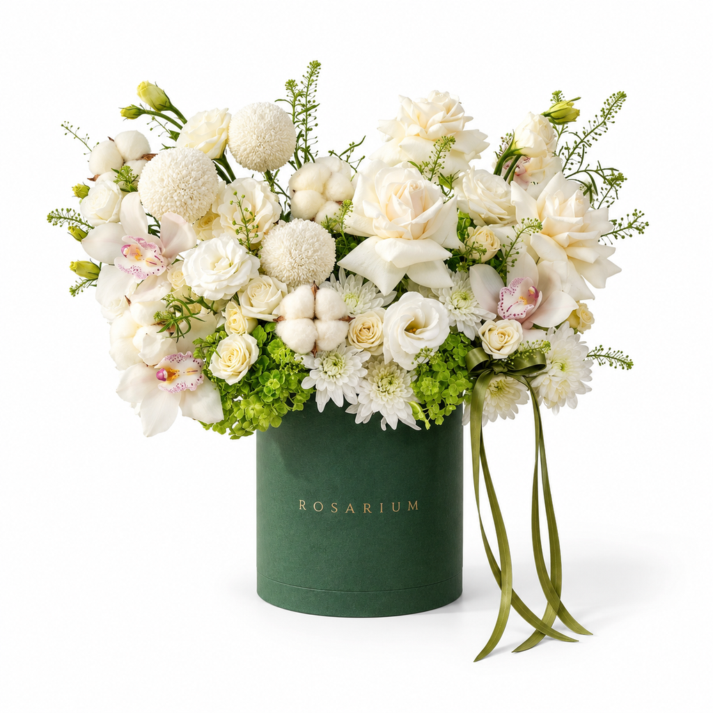 Ivory & Moss main view, ivory roses, white orchids, white chrysanthemums, cotton bolls and green hydrangea in a forest green Rosarium box