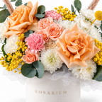 Peachy Magic floral detail, white chrysanthemums, peach roses, pink carnations, peach spray roses and yellow craspedia in a off-white Rosarium box
