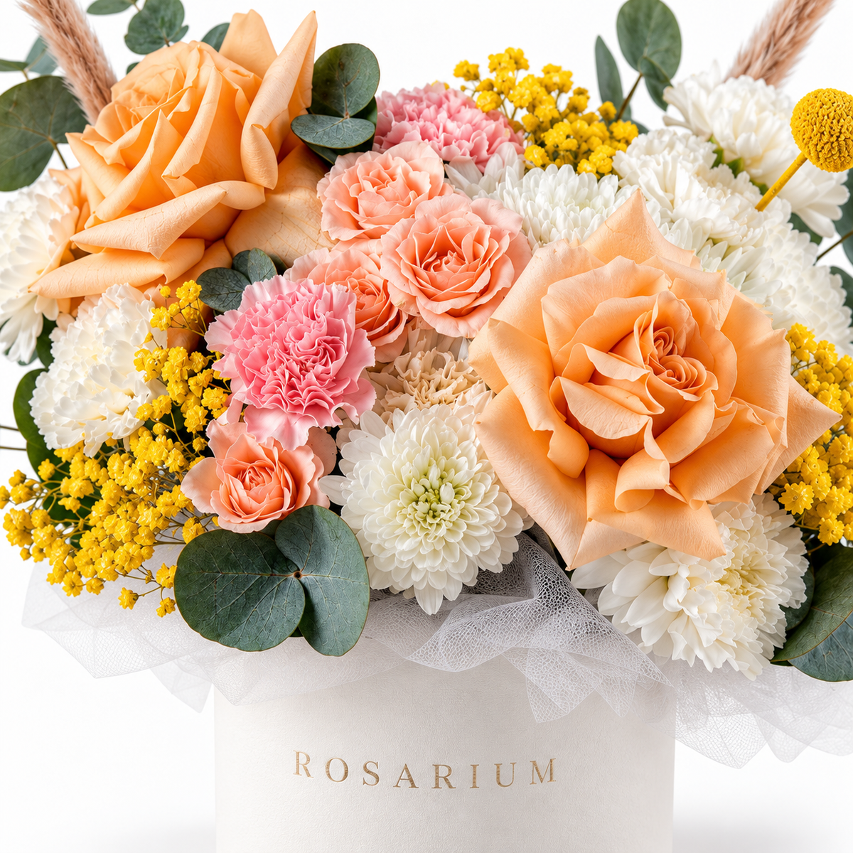 Peachy Magic floral detail, white chrysanthemums, peach roses, pink carnations, peach spray roses and yellow craspedia in a off-white Rosarium box