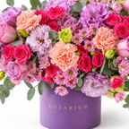 Lilac Royalty floral detail, magenta and lavender roses, ruffled lilac blooms, peach carnations and pink chrysanthemums in a muted lavender Rosarium box