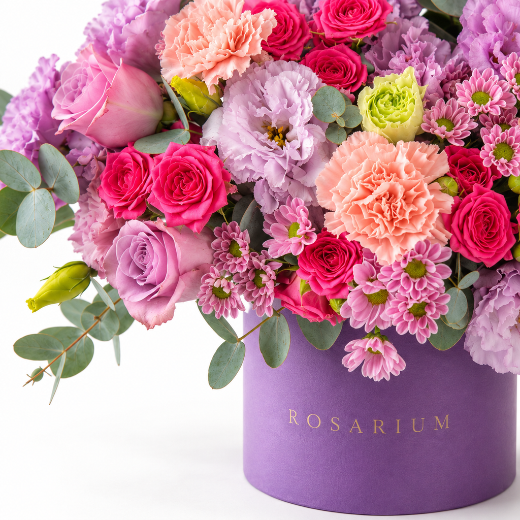 Lilac Royalty floral detail, magenta and lavender roses, ruffled lilac blooms, peach carnations and pink chrysanthemums in a muted lavender Rosarium box
