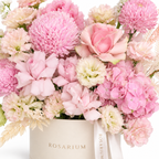 Pink in Full Bloom floral detail, blush roses, pink disbud chrysanthemums, pink hydrangea and cream lisianthus in a off-white Rosarium box