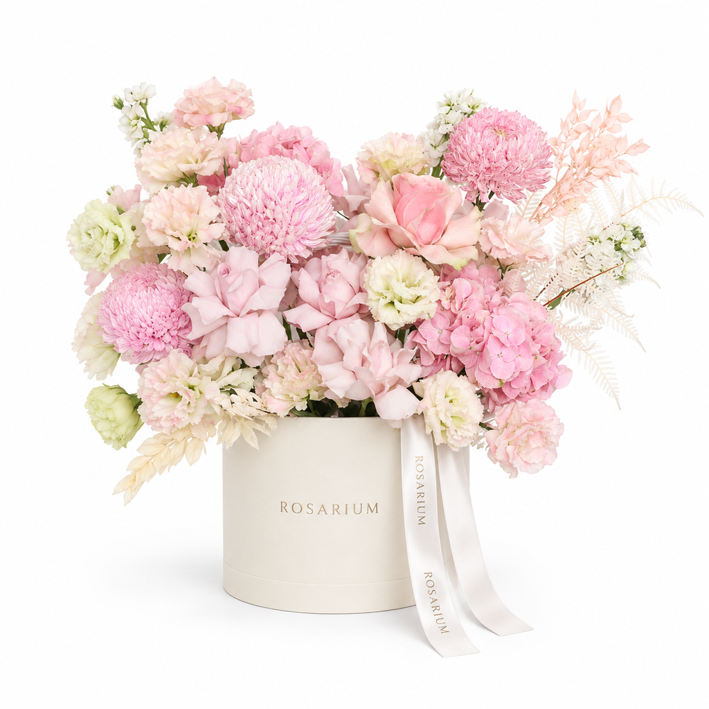 Pink in Full Bloom main view, blush roses, pink disbud chrysanthemums, pink hydrangea and cream lisianthus in a off-white Rosarium box