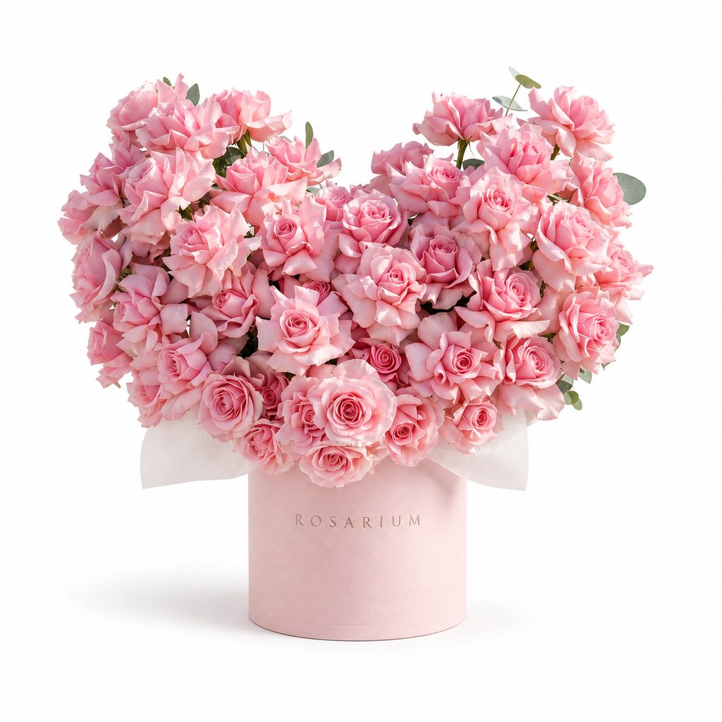 Pink-Hearted main view, pink roses in a light pink Rosarium box